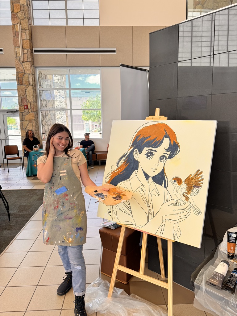 Raquel Madrigal live painting at the Ignite Your Potential event