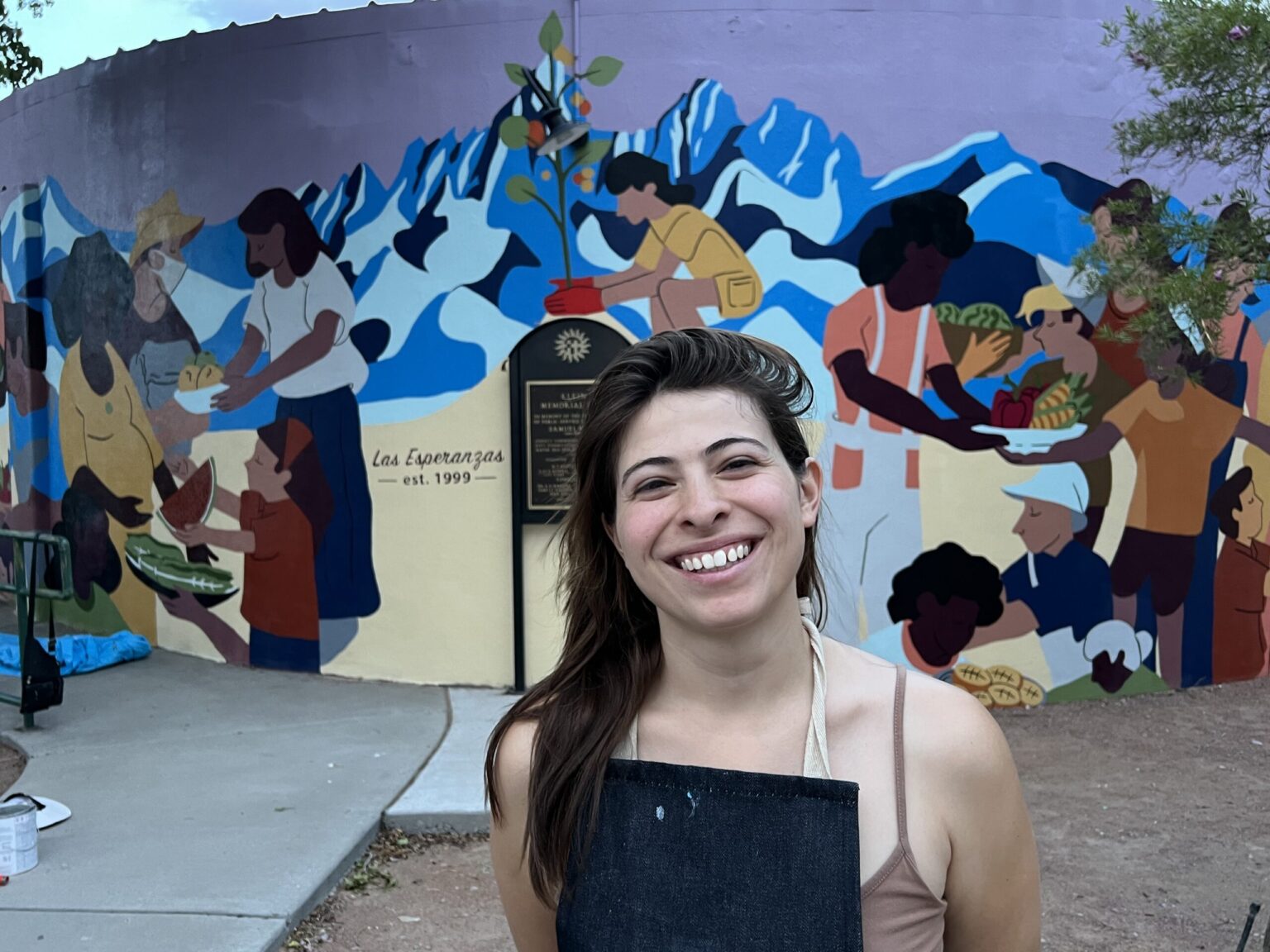 Raquel Madrigal in front of her Klein Park community mural