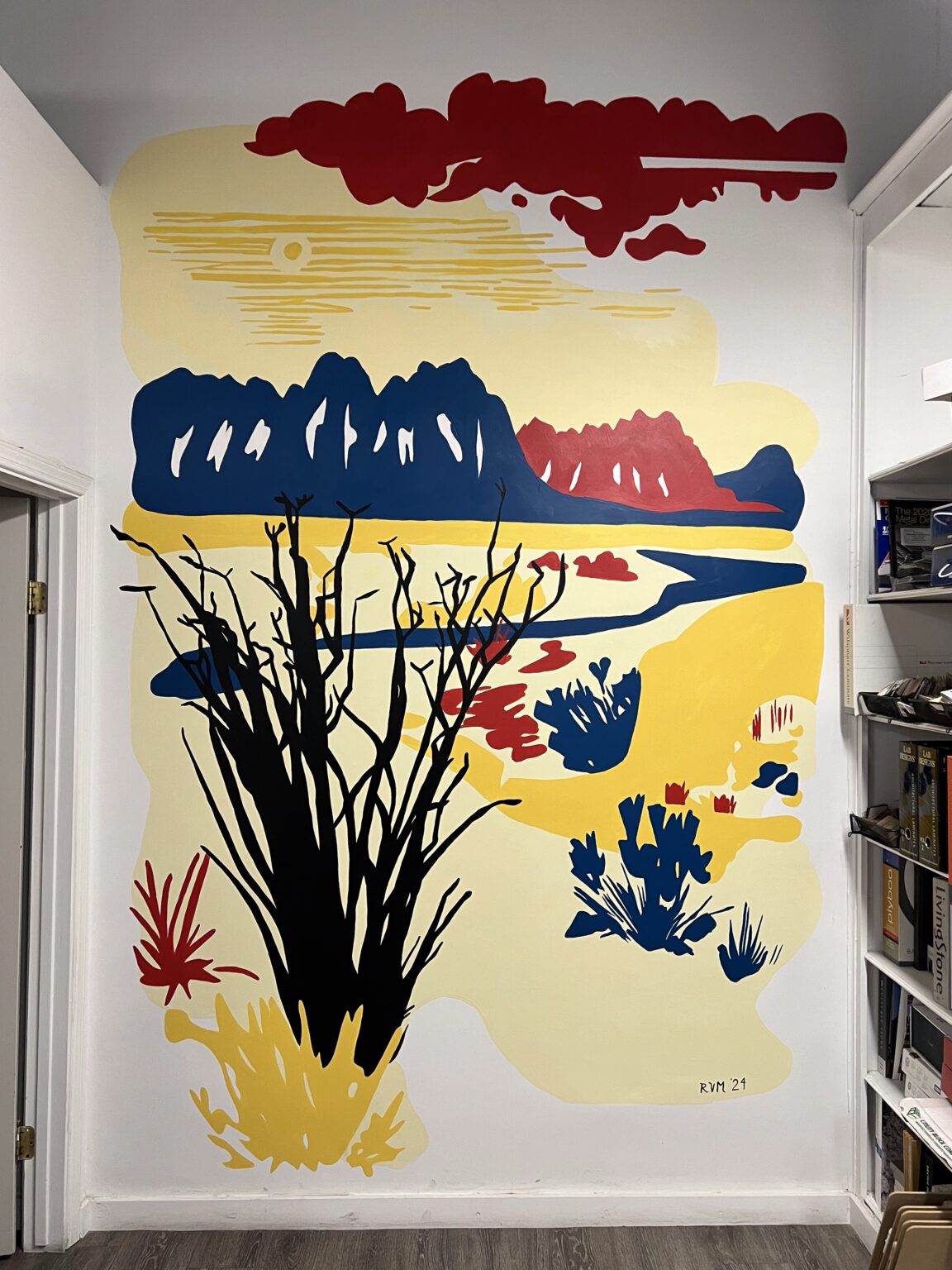 Interior office mural for Desert Peak Architects — Organ Mountains, arroyo, and ocotillo in a bold primary palette